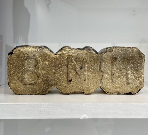 BNM peat briquette sprayed gold, in the 'Museum of Broken Things' – Cavan County Museum