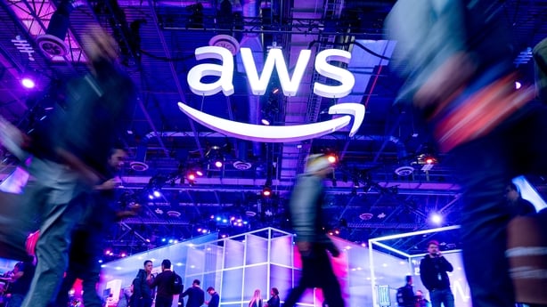 Attendees walk through an expo hall at AWS re:Invent 2023, a conference hosted by Amazon Web Services, at The Venetian Las Vegas on November 28, 2023 in Las Vegas, Nevada. (Photo by Noah Berger/Getty Images for Amazon Web Services)