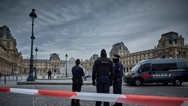 French Police officers seal off the entrance to the Louvre Museum after a Jewllery Heist on October 19, 2025 in Paris, France. France's Culture Minister, Rachida Dati, announced the closure of the world-famous art museum on X due to the robbery taking pla