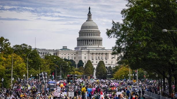 Protesters march along Pennsylvania Avenue during the second "No Kings" protest in Washington, DC