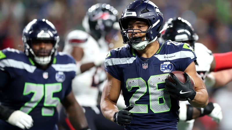 Zach Charbonnet of the Seattle Seahawks scores a touchdown