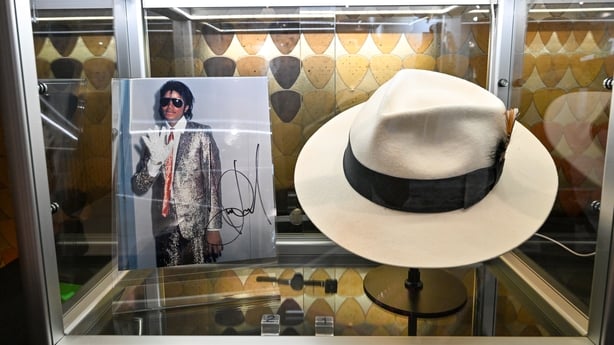 A Michael Jackson autographed photograph and Michael Jackson's Smooth Criminal music video White Fedora, 1988, is seen during the Propstore music memorabilia auction photocall at The Cumberland Hotel on 20 October, 2025 in London