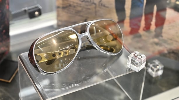 Elvis Presley's original pair of worn Grand Prix sunglasses are seen during the Propstore music memorabilia auction photocall at The Cumberland Hotel on 20 October, 2025 in London