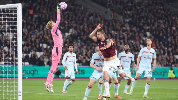 Brentford's Caoimhin Kelleher catches the ball under pressure from West Ham United's Tomas Soucek during the Premier League match between West Ham United and Brentford at London Stadium on October 20, 2025 in London, England.