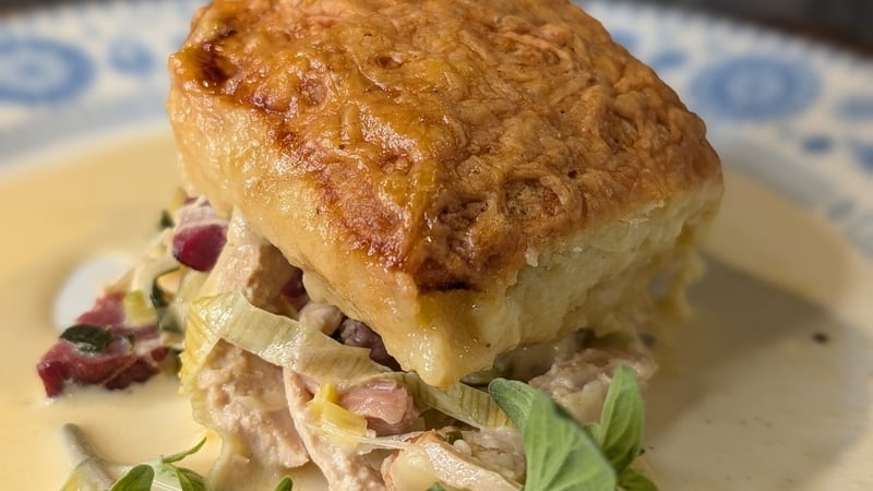 This hearty chicken and bacon pie is served with cheesy dumplings