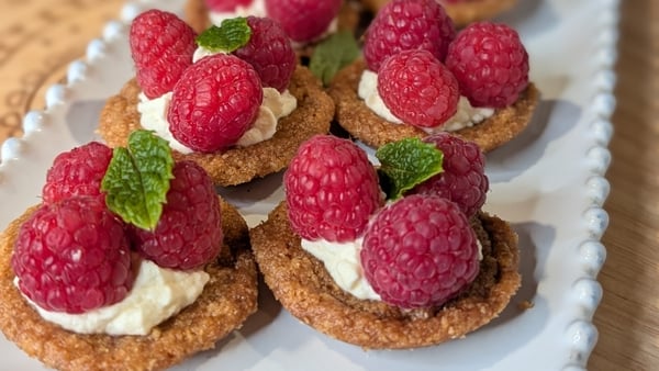 Mini raspberry tarts filled with whipped cream