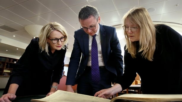 A photo of Minister Patrick O'Donovan, National Archives Director Orlaith McBride and Jessica Baldwin, senior conservator at the National Archives