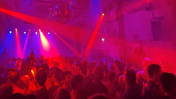 People dance at SchwuZ in Berlin, the oldest and largest queer club of Germany, according to its general manager, on 11 October 2025