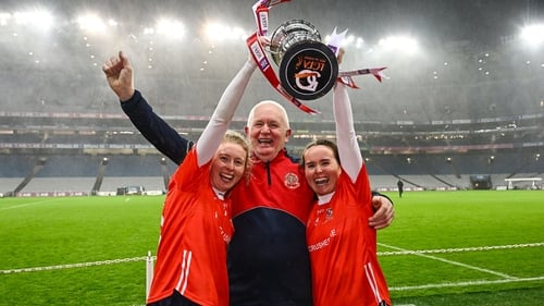 Louise Ward (L) and sister Nicola celebrate with dad Willie after last year's All-Ireland triumph