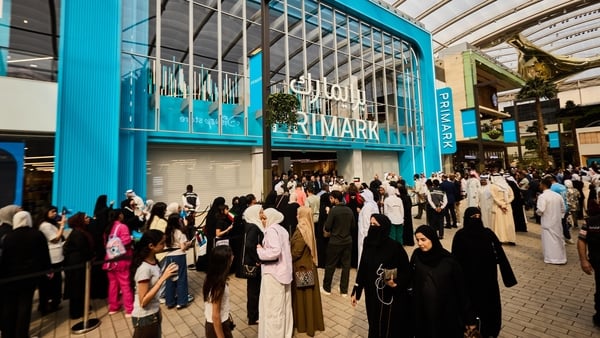 Image of a shopping centre with a Primark store and lots of people walking around