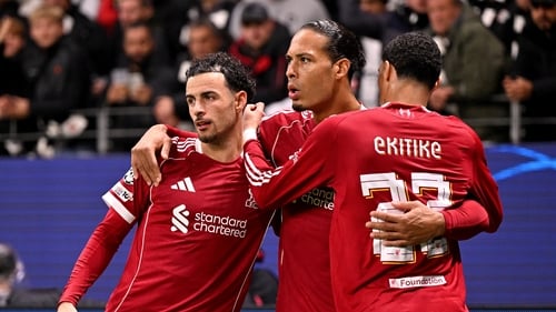 Virgil van Dijk of Liverpool celebrates scoring his team's second goal against Eintracht Frankfut with Curtis Jones and Hugo Ekitike