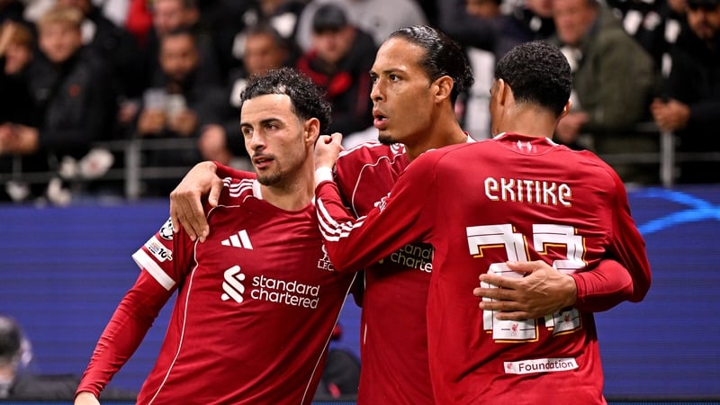 Virgil van Dijk of Liverpool celebrates scoring his team's second goal against Eintracht Frankfut with Curtis Jones and Hugo Ekitike