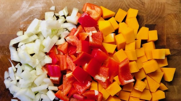 Onions, red peppers and squash chopped ready to make soup