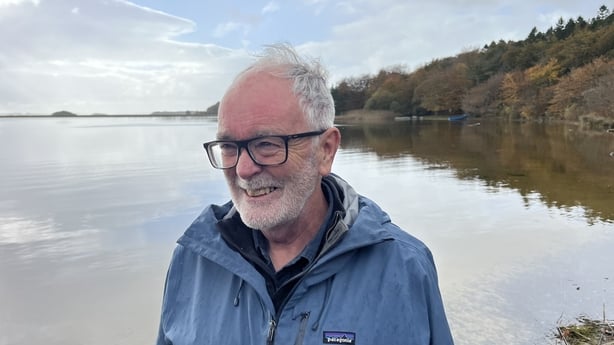 a photo of Dr Cilian Roden with lough carra in the background