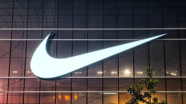 Image of the Nike logo on the front of a glass fronted store
