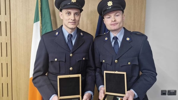 Garda Nigel Murphy and Garda Conor Treacy with their Scott medals for bravery in the line of duty