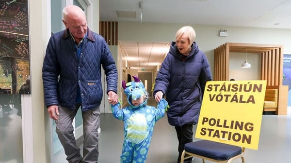 Photo shows grand Daughter Lake Costello with her grandparents Michael and Stephanie Mooney after voting in presidential election in the polling station at the Deaf Village, Cabra West