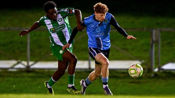 UCD's Adam Brennan gets away from the challenge of Alain Kizenga of Bray Wanderers 