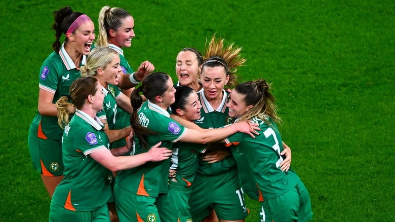 Marissa Sheva is mobbed after her goal against Belgium