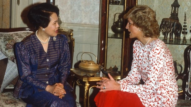 BANGKOK, THAILAND - FEBRUARY 04: Diana, Princess of Wales, wearing a red and white patterned dress designed by Catherine Walker, speaks to Queen Sirikit of Thailand as she visits Chitralada Royal Villa, part of the Dusit Palace on February 4, 1988 in Bangkok, Thailand. (Photo by Anwar Hussein/Getty 