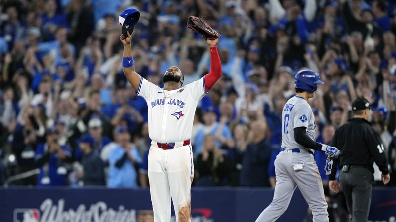 Vladimir Guerrero Jr of the Toronto Blue Jays celebrates as Shohei Ohtani walks to the dugout