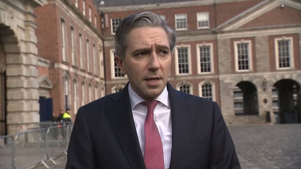 Photo shows Tánaiste Simon Harris being interviewed outside Dublin Castle