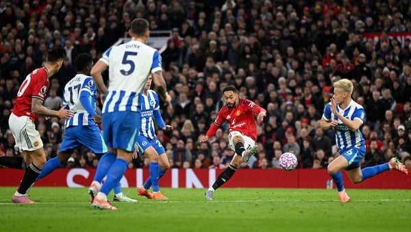 MANCHESTER, ENGLAND - OCTOBER 25: Matheus Cunha of Manchester United scores his team's first goal during the Premier League match between Manchester United and Brighton & Hove Albion at Old Trafford on October 25, 2025 in Manchester, England. (Photo by Sh