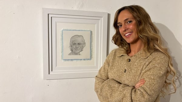 Photo shows artist Fiona Fitzgerald standing beside her portrait of president-elect Catherine Connolly Photo shows artist Fiona Fitzgerald standing beside her portrait of president-elect Catherine Connolly