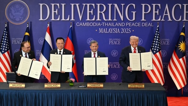 From left to right Malaysia's Prime Minister Anwar Ibrahim, Thailand's Prime Minister Anutin Charnvirakul, Cambodia's Prime Minister Hun Manet and US President Donald Trump hold up documents after the ceremonial signing of a ceasefire agreement between Thailand and Cambodia.