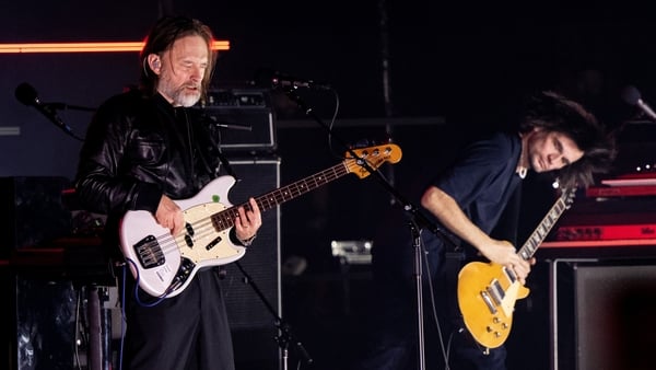 Thom Yorke and Jonny Greenwood performing on stage