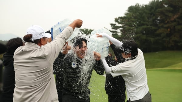 CHEONAN, SOUTH KOREA - OCTOBER 26: Junghwan Lee of South Korea is congratulated by Doyeon Hwang of South Korea after winning the Genesis Championship on day four of the Genesis Championship 2025 at Woo Jeong Hills Country Club on October 26, 2025 in Cheon