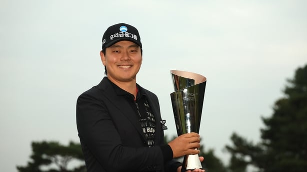 CHEONAN, SOUTH KOREA - OCTOBER 26: Junghwan Lee of South Korea poses with the Genesis Championship trophy on the 18th green following victory on day four of the Genesis Championship 2025 at Woo Jeong Hills Country Club on October 26, 2025 in Cheonan, South Korea. (Photo by Luke Walker/Getty Images)