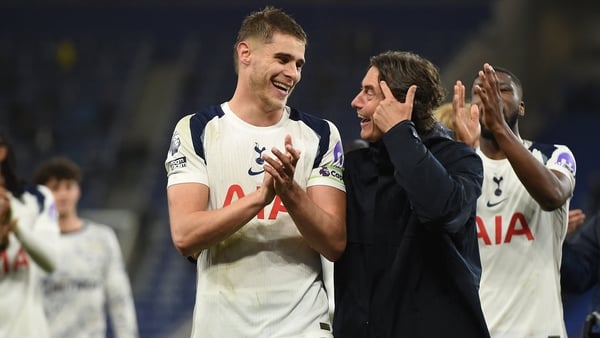 Tottenham Hotspur's Dutch defender #37 Micky van de Ven (L) and Tottenham Hotspur's Danish head coach Thomas Frank (R) celebrate on the pitch after the English Premier League football match between Everton and Tottenham Hotspur at Hill Dickinson Stadium i