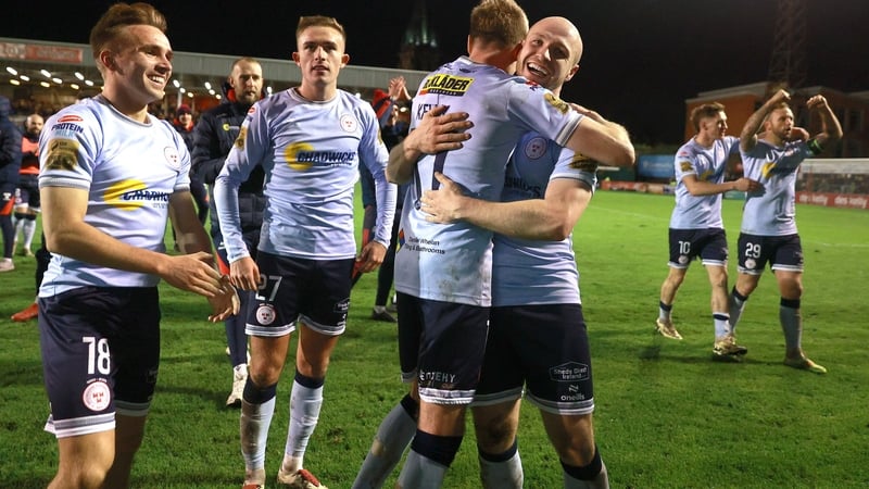 Shelbourne players celebrate with matchwinner Kerr McInroy