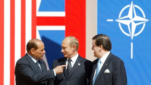 405890 03: (L to R) Italian Prime Minister Silvio Berlusconi, Russian President Vladimir Putin and NATO Secretary General George Robertson talk before the start of the Russia-NATO summit May 28, 2002 in Mario de Bernardi outside of Rome, Italy. In a sweeping reversal of cold war policy, NATO formall