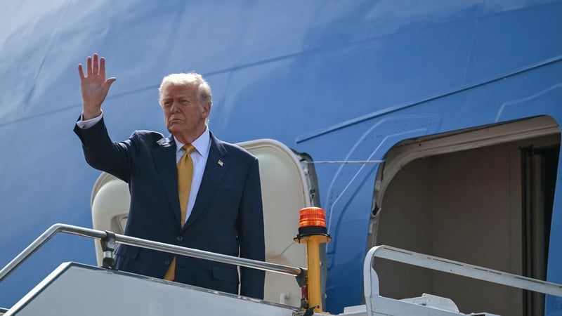 US President Donald Trump waves as he departs on Air Force One from Kuala Lumpur International Airport