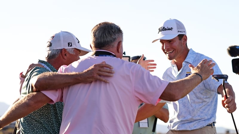 Michael Brennan (R) celebrates with friends and family after his win in Utah