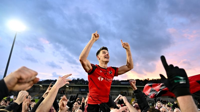 Niall Grimley celebrates with Madden supporters after their Armagh final win