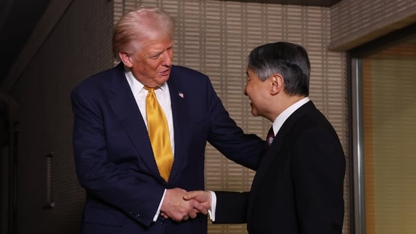 US President Donald Trump is greeted by Japanese Emperor Naruhito at the Imperial Palace in Tokyo, Japan
