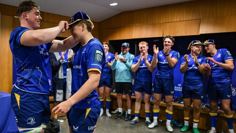 Leinster's Ciarán Mangan is presented with his first cap by team-mate and brother Diarmuid