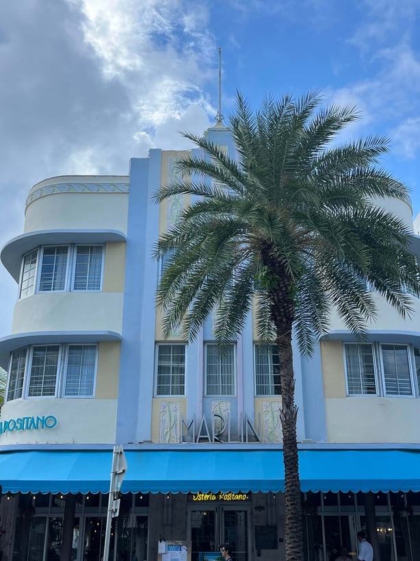 A blue and yellow art deco building in Miami