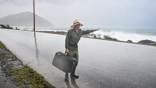 Cuban man hitchhikes during Storm Melissa