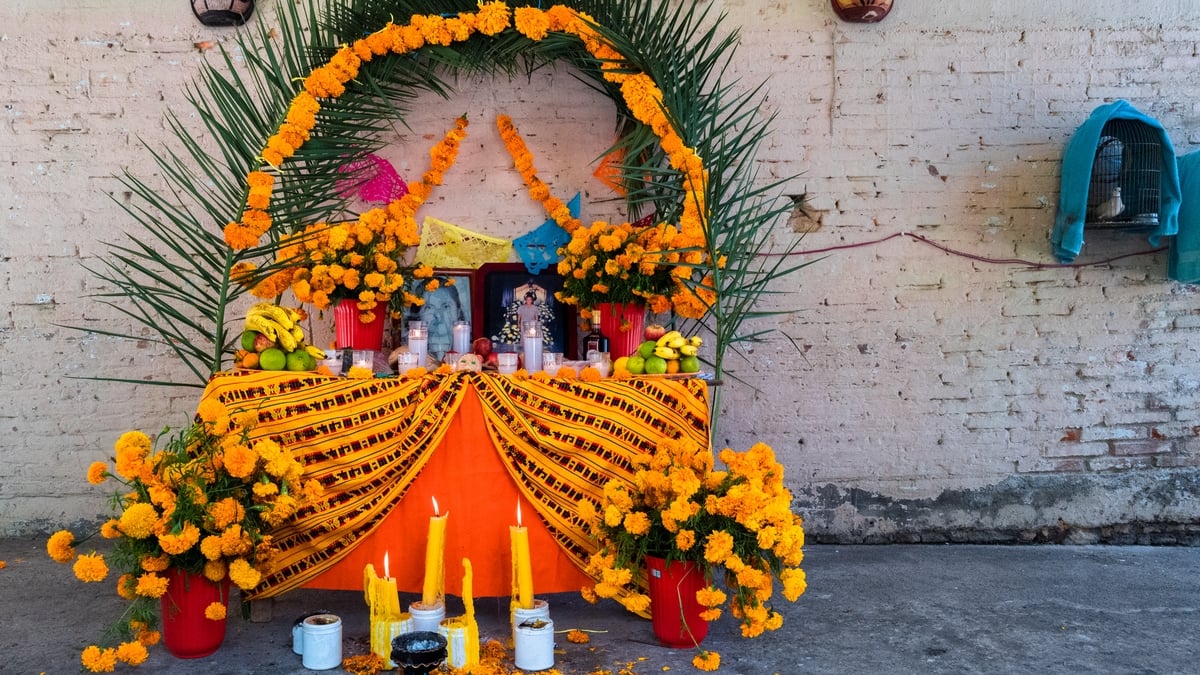 TLAPA DE COMONFORT, MEXICO - NOVEMBER 02: An altar of the dead (Altar de Muertos), a religious site honoring the deceased, is placed inside a house during the Day of the Dead celebrations on November 2, 2021 in Tlapa de Comonfort, Mexico. Day of the Dead