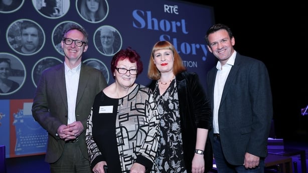 writer Mary O'Rourke with 2025 RTÉ Short Story Competition judges Neil Hegarty, Jan Carson and Tristan Rosenstock, on stage at awards night at Pavilion Theatre Dun Laoghaire