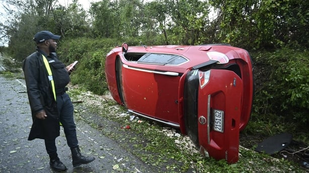 A police officer inspects a car