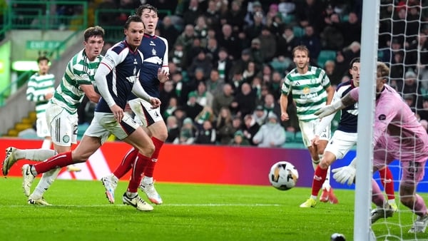 Celtic's Johnny Kenny (left) scores