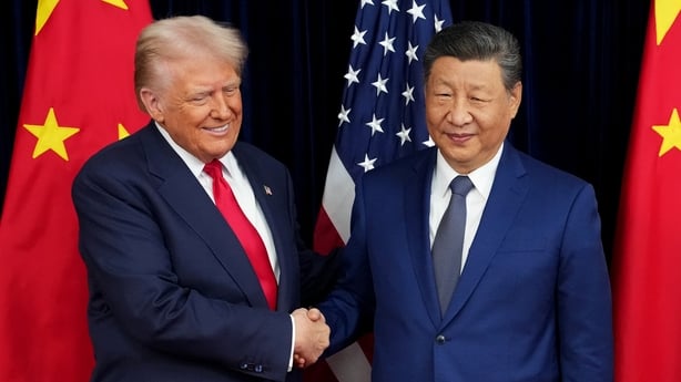 Donald Trump and Xi Jinping shake hands