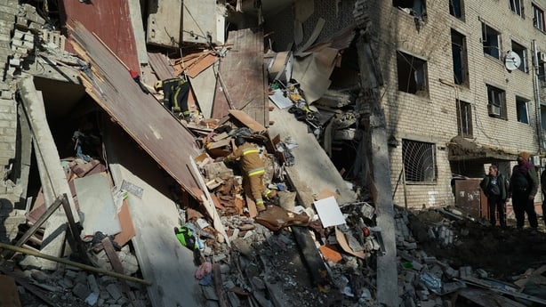 Rescuers conduct search-and-rescue operation at partially destroyed residential building