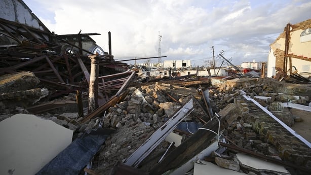 Debris is scattered along a road