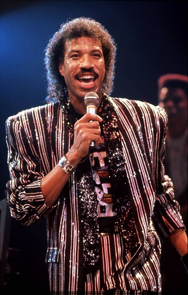 A photo of Lionel Richie wearing a striped suit